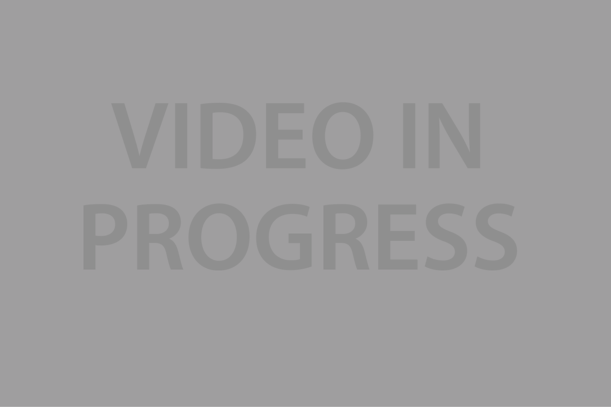 The text "VIDEO IN PROGRESS" is partially obscured by a white overlay with faint gray letters.